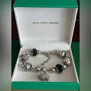 New in original box silver plated JCP Women’s men’s charm bracelet.